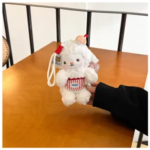 Cute plush sheep keychain detail shot, fluffy stuffed animal pendant with mini apron.
