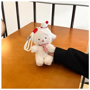 Cute fluffy sheep plush toy keychain, soft stuffed animal doll pendant with red hat and scarf.