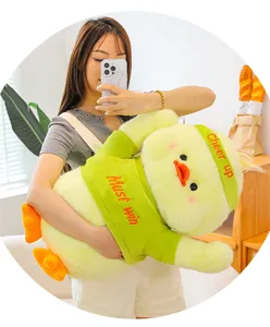 Cute yellow duck plush toy with green outfit and headband, soft huggable doll pillow for kids.