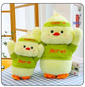 Cute yellow plush duck toy set with removable green t-shirt and headband, soft stuffed doll gift.