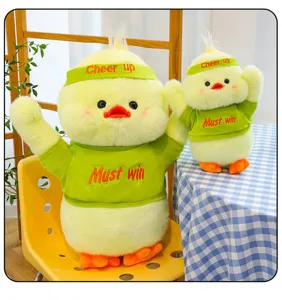 Cute yellow plush duck toy with green removable clothes and headband, soft stuffed animal gift.