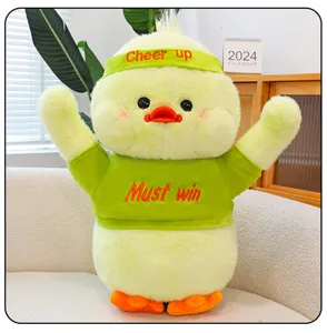 Cute yellow plush duck toy with green headband and t-shirt, soft stuffed doll gift for kids.
