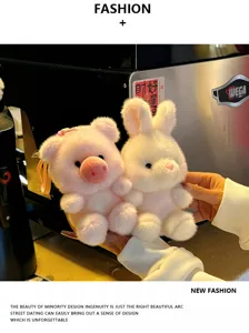 Cute plush pig and bunny pendant toy close-up, soft furry texture, lovely bag charm display.