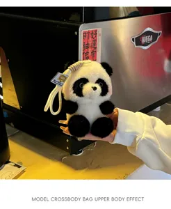 Cute plush panda pendant, fluffy bag charm and toy, perfect handheld detail display style.