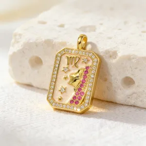 Detailed shot of the gold-plated Virgo zodiac pendant sparkling with cubic zirconia.