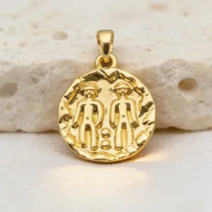 Detailed close-up of a vintage gold coin pendant featuring a twin relief design, gold-plated.