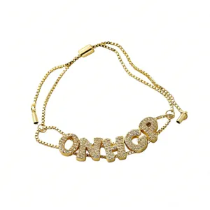 Gold adjustable slider bracelet featuring sparkling paved zirconia letter charms for women.