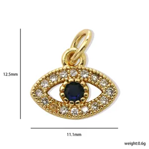 Gold evil eye pendant detail showing dimensions 12.5mm height, 11.1mm width and 0.6g weight.