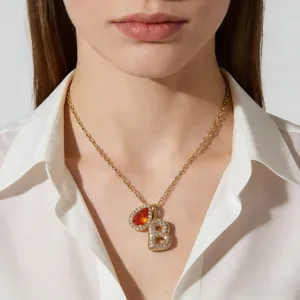 Elegante vergulde ketting met letter B hanger en druppelvormige geboortesteen detail.