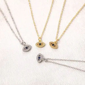 Evil eye pendant necklace set in gold and silver, elegant clavicle chain for daily wear.
