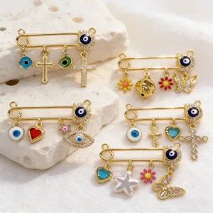 Gold evil eye safety pin pendant set with cross and heart charms for DIY jewelry making accessories.