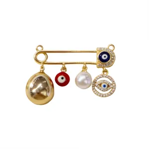 Gold-tone evil eye safety pin brooch vintage charm elegant fashion jewelry accessory