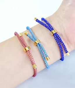 Detailed close-up view of braided Milan rope bracelets featuring adjustable gold metal sliding beads.
