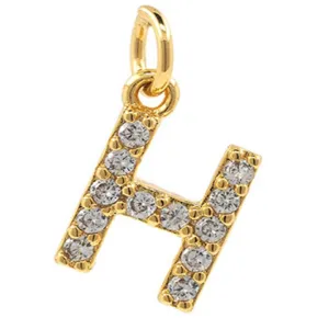 Detail view of gold-plated copper micro-paved cubic zirconia letter H pendant accessory.