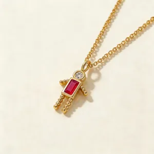 Collar con colgante de niño chapado en oro con piedra roja y cabeza de circón brillante.