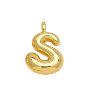 Detailed view of the 3D puffy letter S gold pendant showing shiny metallic surface.