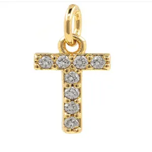 Detailed close-up of gold-plated copper letter T micro-pave cubic zirconia pendant charm.