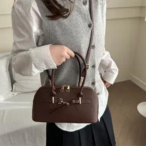 Stylish brown retro top-handle commuter handbag, versatile underarm and crossbody bag for women.