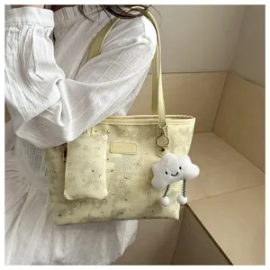 Casual yellow star moon tote bag detail view, large capacity shoulder bag with cute cloud charm.