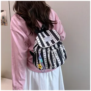 Stylish striped casual backpack with bow pattern, perfect for daily student commuting.