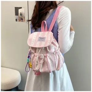 Pink striped cute backpack for women, casual school book bag with bow pattern and side pockets.