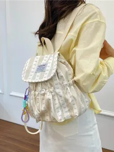 Chic striped canvas backpack with cute bow pattern, perfect for school, casual daily use.
