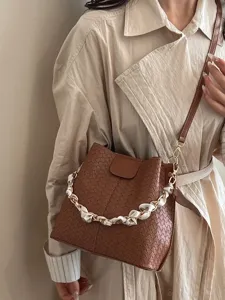 Stylish brown woven bucket bag with chain and scarf handle for women trendy crossbody bag.