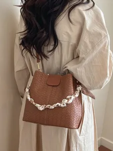 Retro woven bucket bag for women, stylish commuting single shoulder crossbody bag with scarf.