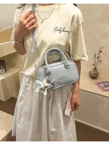 Detail view of the stylish light blue women shoulder crossbody handbag with cute star charms.