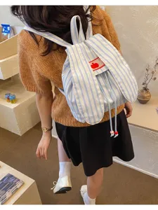 Cute striped canvas backpack with bunny ears and bow detail, casual daily commuter student bag.