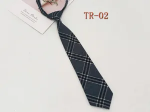 Detailed view of dark grey plaid JK tie, pre-tied lazy style for daily school uniform.