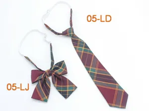 Details of the Japanese JK uniform plaid necktie and bow tie set, showing neat stitching.