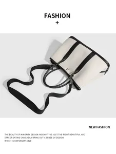 Klassische schwarz-weiße Canvas-Leder-Tragetasche mit Schultergurt für Damen groß.