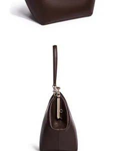 Braune Vintage Kussverschluss Handtasche mit Griff und Schultertasche Detailansicht.