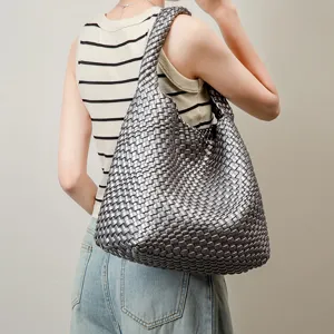 Handwoven metallic grey hobo shoulder bag showcasing soft texture and large capacity.