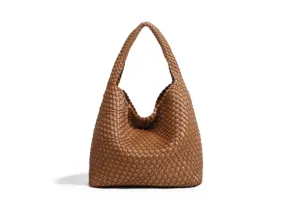 Detail view of brown woven leather handbag showing soft texture and distinctive pattern.