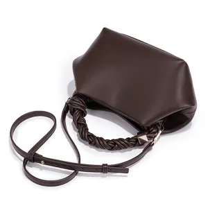 Detailed view of the dark brown women's PU leather shoulder bag featuring a unique braided handle.