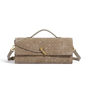 Detailed view of the taupe woven leather shoulder bag showcasing artisan intrecciato craftsmanship.