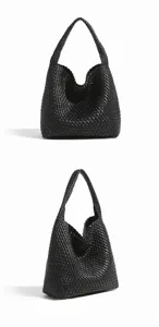 Close-up view of black woven leather handbag showing soft texture and detailed intrecciato pattern.