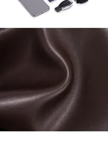 Premium brown leather texture detail shot, showing fine grain and durable material quality for bags.