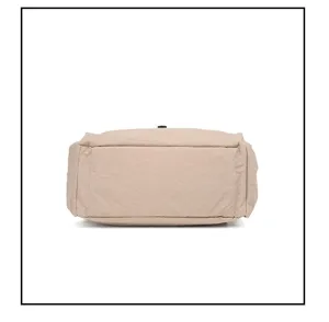 Detail view of the bottom of a casual solid color nylon backpack in light khaki color.
