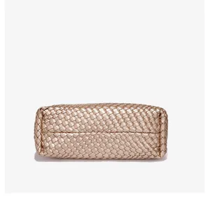 Woven handbag bottom detail view, luxury style PU leather texture, elegant daily accessory.