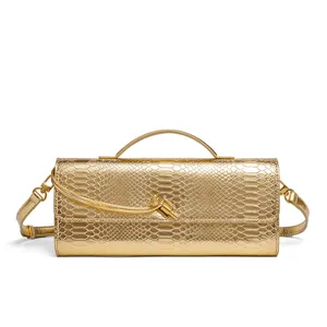 Gold metallic snake embossed women baguette bag, elegant evening clutch with top handle.