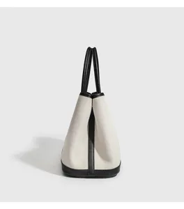 Detailansicht der Leinentasche, elegantes Schwarz-Beige-Design, stilvoller Damen Shopper.
