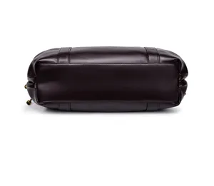 Detailed bottom view of dark brown soft leather women handbag tote bag, premium commuter style.