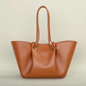Elegant brown leather tote bag with stylish pleated design and double shoulder straps for women.