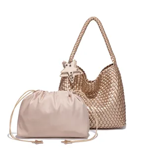 Detailed view of gold woven hobo shoulder bag with chic star charm and matching pouch set.