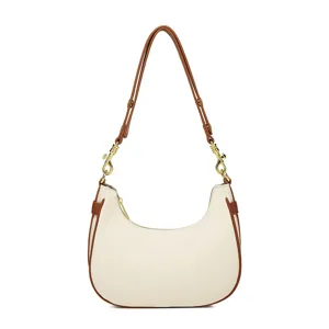 Chique minimalistische witte hobo-schoudertas voor dames met bruine lederen afwerking.