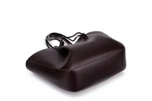 Dark brown leather tote bag detail, featuring pleated design and thin knotted shoulder straps.