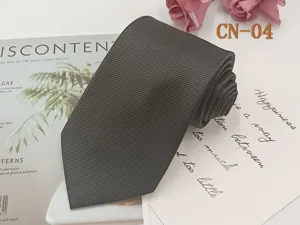 Close-up of black striped men formal business necktie showcasing fine jacquard weave texture.